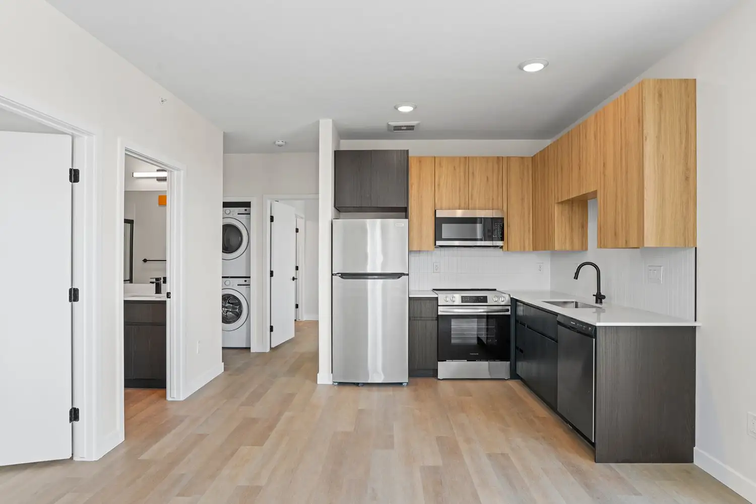 Modern kitchen with stainless steel appliances.